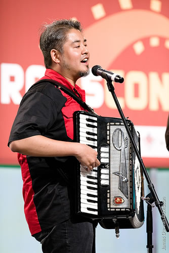 Joey deVilla on accordion, onstage at RailsConf 2007.