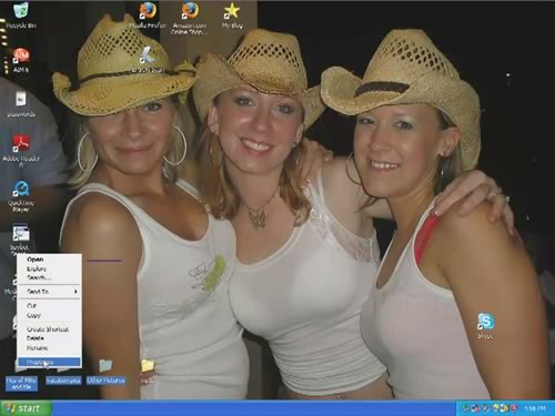 Desktop of the computer used in the Consumerist sting: three women in cowboy hats and skimpy tanktops.
