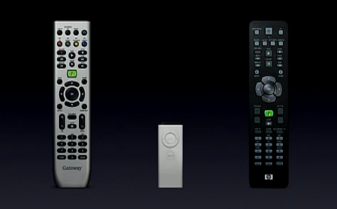 Two complex TV remotes and the very simple Apple TV remote