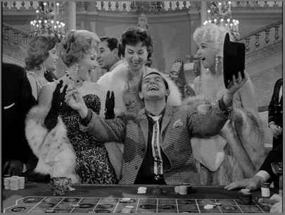 Man surrounded by women at a casino, winning