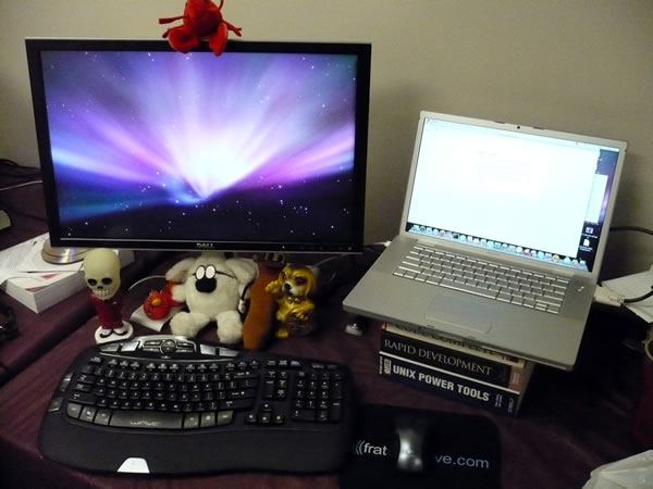 TSOT standard-issue developer gear: 15″ MacBook Pro, 24″ Dell widescreen LCD monitor and Logitech Wave cordless keyboard and mouse.