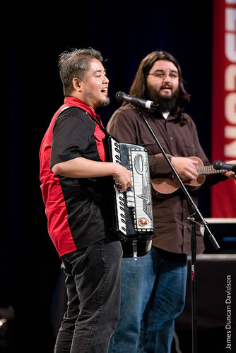 Joey deVilla on accordion and Chad Fowler on ukelele, onstage at RailsConf 2007.