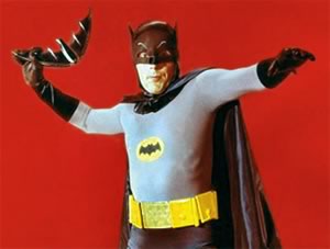The Adam West Batman, hurling his batarang