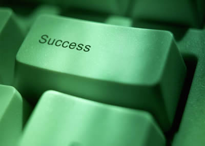 Key on a computer keyboard labelled “Success”