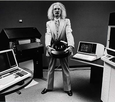 Wild-haired guy surrounded by old computers