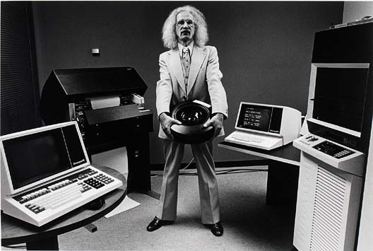 Wild-haired guy surrounded by old computers
