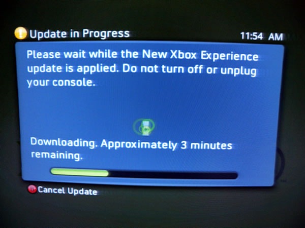 Photo of my TV showing the 'updating' dialog box for the New XBox Experience.