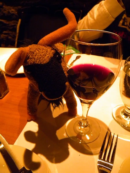 My plush gnu with a glass of red wine