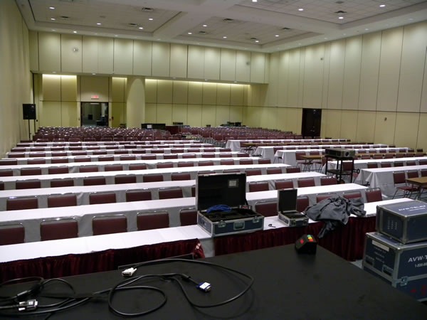 View of a large presentation room, as seen from the podium at the front.