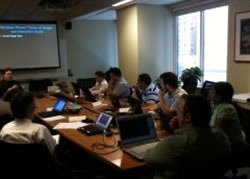 Photo of Windows Phone 7 bootcamp Montreal attendees sitting at a boardroom table