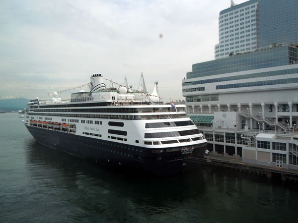 Holland America liner, moored to Vancouver Convention Centre's East Building