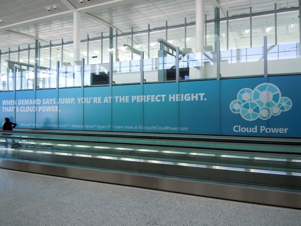 Ad for Microsoft cloud solutions along walkway in Pearson Airport: "When demand says jump, you're at the perfect height. That's cloud power."
