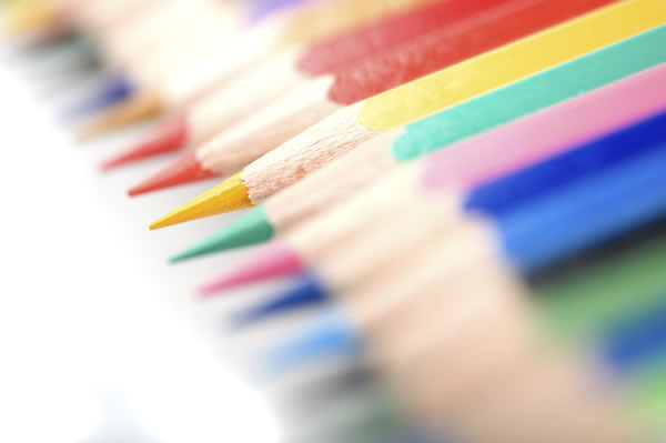 Colored pencils, all lined up in a row