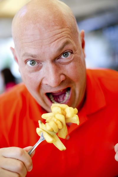 Dude ready to inhale a big forkful of fries