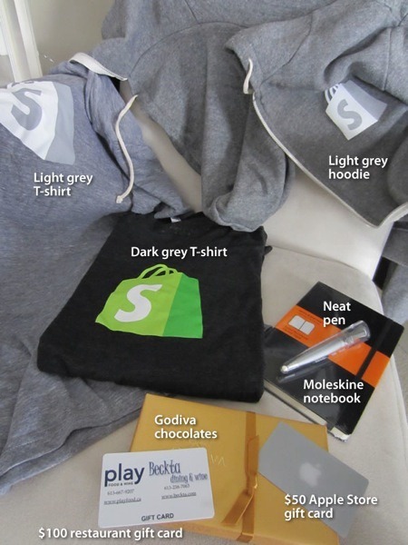 Even more Shopify standard issue gear: Light grey Shopify t-shirt, dark grey Shopify t-shirt, light grey Shopify hoodie, neat pen, Moleskine notebook, Godiva chocolates, $100 restaurant gift card, $50 Apple Store gift card