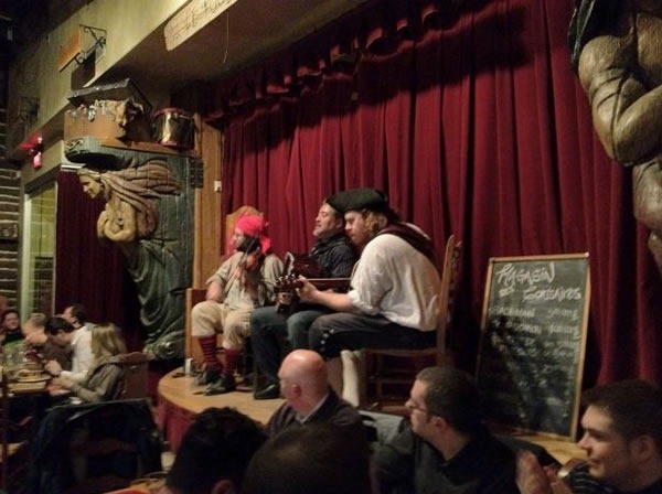 Joey deVilla playing accordion onstage with the pirates at Le Cabaret du Roy.