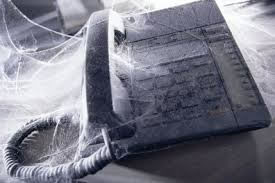 phone covered in cobwebs