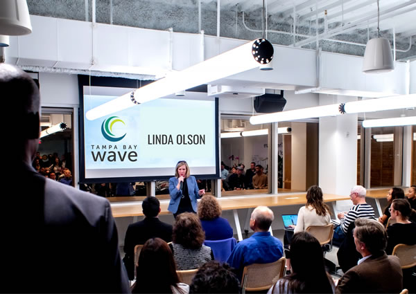 Photo: Linda Olson speaks at a Tampa Bay Wave presentation.