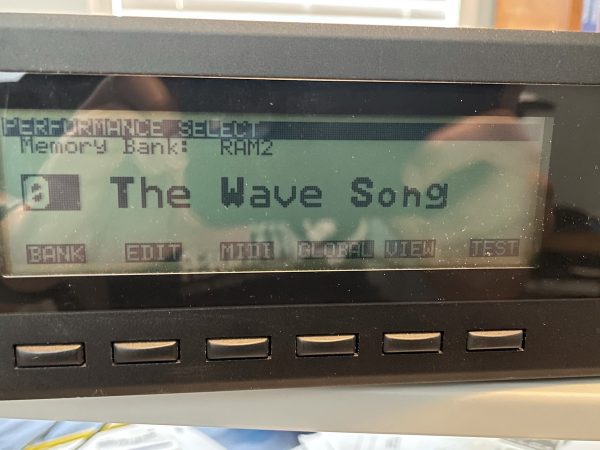 LCD display of Korg Wavestation A/D displaying the name of the currently selected sound: “The Wave Song”.