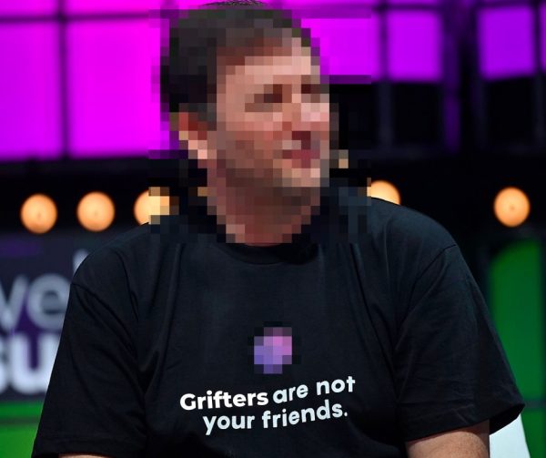 Photo of Celsius’ Alex Mashinsky with his face blurred out, and his t-short edited to read “Grifters are not your friends.”