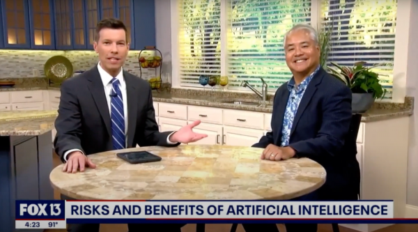 Chris Cato and Joey deVilla during a live interview of FOX 13 News Tampa. The caption in the “lower third” reads “Risks and benefits of artificial intelligence.”